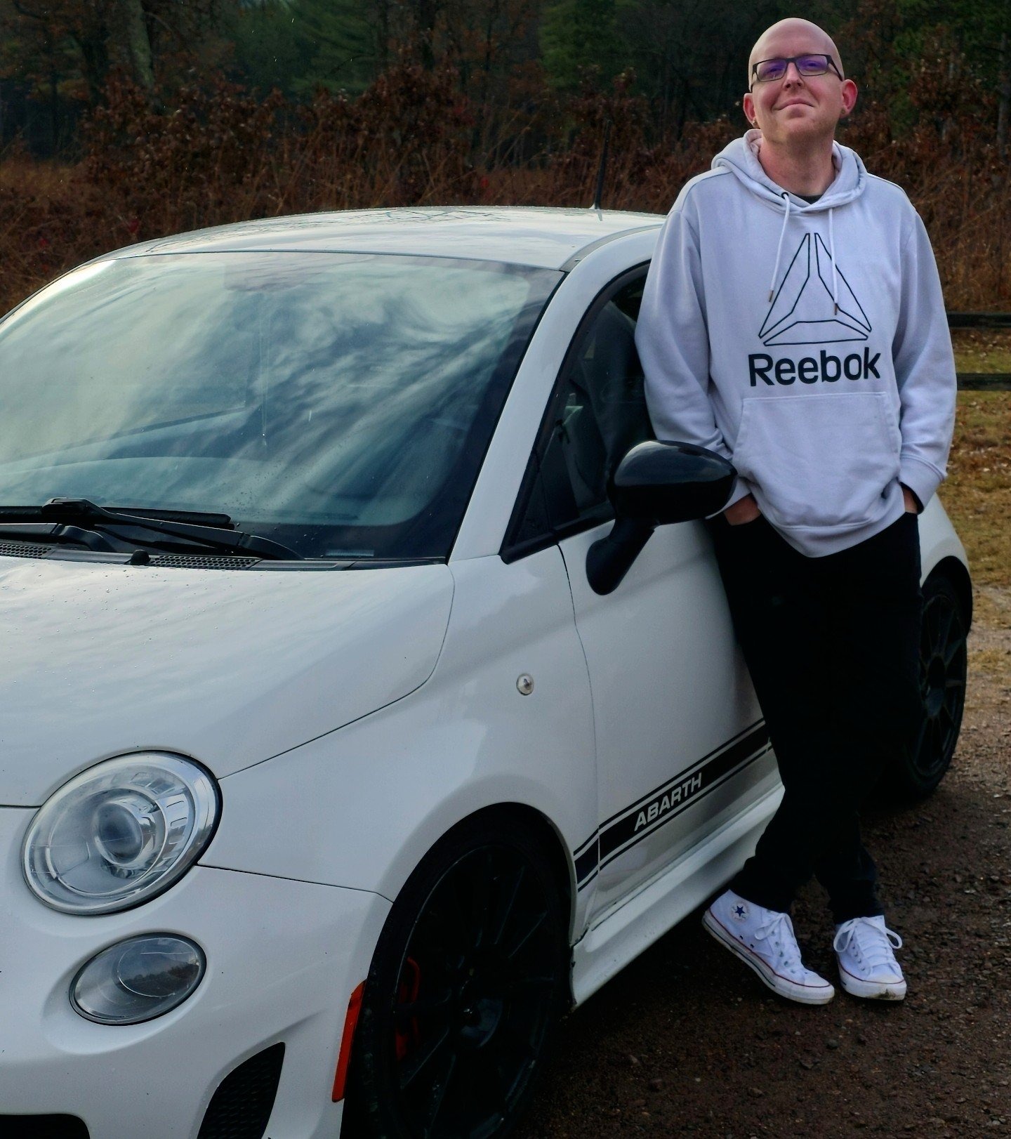 Chad Standing Next To White Fiat Abarth Car